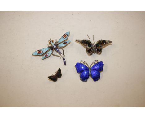 A white metal and blue enamel butterfly brooch; an enamel work dragonfly brooch; another enamel brooch and a beadwork butterf