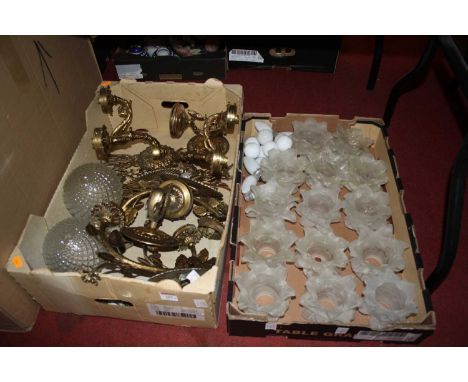 A pair of brass wall light fittings, each having a single sconce supported by a dolphin on further circular plate, together w
