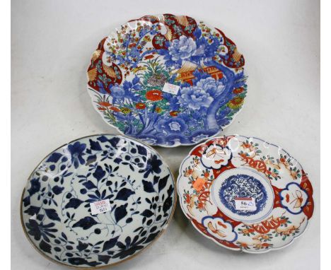 A 20th century Japanese Arita enamel decorated stoneware charger, dia.31cm; together with a similar Japanese plate; and a blu