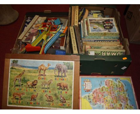 Two boxes of miscellaneous items to include various ticket stubs, boxed Corgi Volvo car transporter, tinplate and jigsaws etc