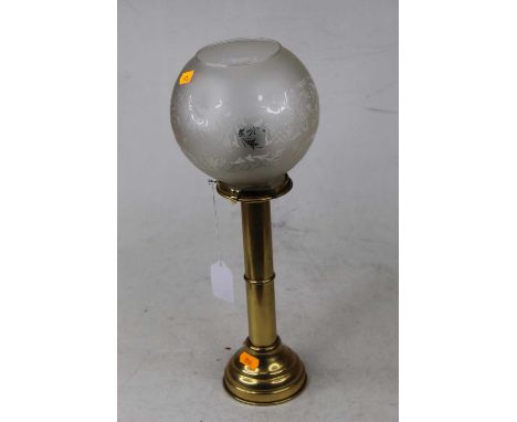 An early 20th century brass pedestal candle lantern having etched opalescent globular shade, height 39cm
