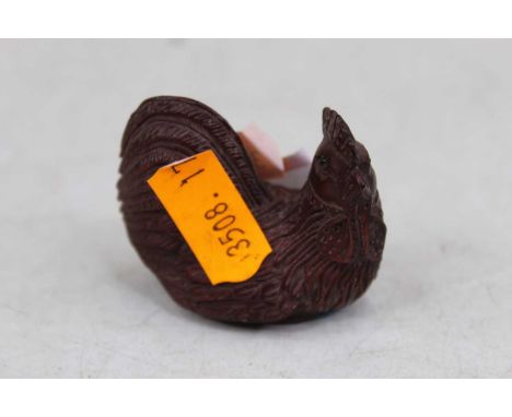 A reproduction netsuke, moulded in the form of a cockerel