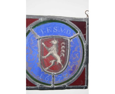A single lead light depicting armorial and bearing date 1677, w.17cm 