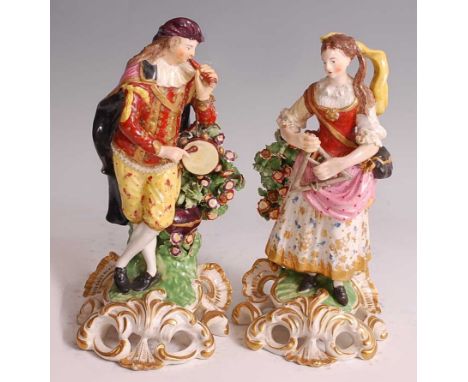 A pair of early 19th century probably Derby soft-paste porcelain figures "The Idyllic Musicians", him playing the tabor and p