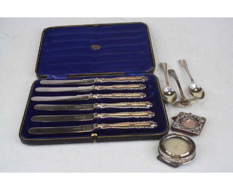 A cased set of six early 20th century tea knives, having steel blades and silver clad handles retailed by T Read &amp; Son, T