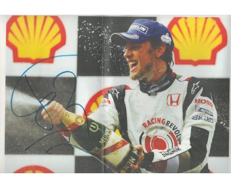 Jenson Button signed 18x12 colour photo. All autographed items come with a Certificate of Authenticity. We combine postage on