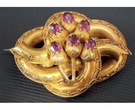 Victorian gold amethyst set brooch, of twisted form and filigree mounted, applied with six amethyst set 'buds', weight 8.3g a