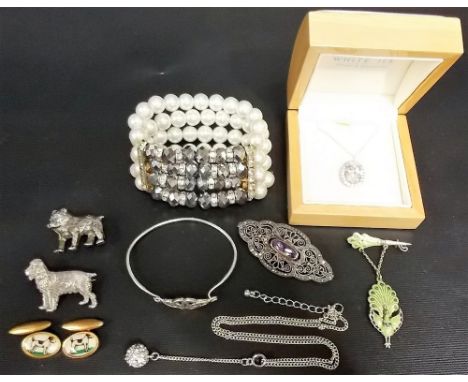 Tin of costume jewellery inc. a silver filigree amethyst brooch etc