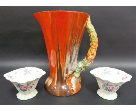 Clarice Cliff Wilkinson Ltd relief moulded jug with painted trailed decoration (restored); together with a pair of Clarice Cl