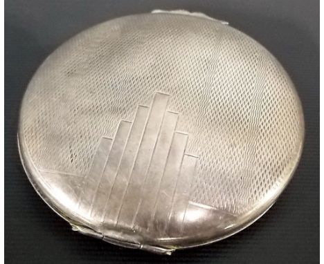 Silver engine turned circular compact, maker B & Co, Birmingham 1947, diameter 2.75'.
