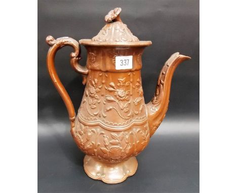 19th Century salt glazed relief moulded large teapot, decorated with foliate relief panels with a scroll handle, height 13.5'