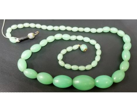 Green Jade graduated oval bead necklace, the beads graduate from approximately 7mm to the largest 22mm approx. and with a thr