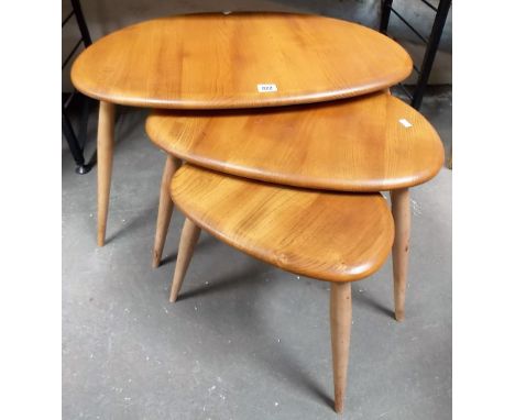 Ercol light elm pebble nest of three tables.