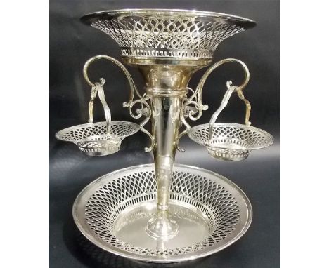 Impressive silver table epergne by Huckin & Heath, of pierced basket form, the large central dish over three swing handled ha