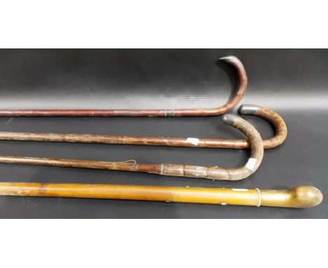 Three silver mounted walking canes together with a walking stick with horn handle (4)