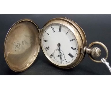 Omega silver crown wind full hunter pocket watch, the white enamel dial with roman numerals & subsidiary seconds dial, the en