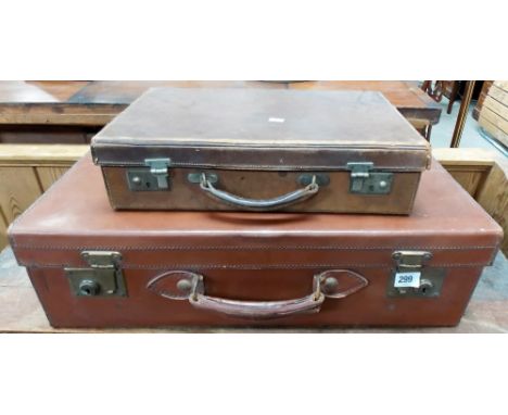 Two vintage leather suitcases.