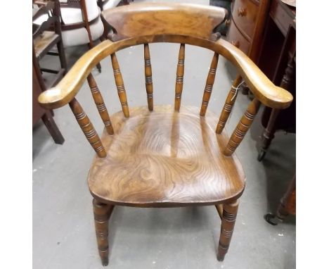 Early 20th Century beech and elm Captain's bow armchair, the back of the elm seat stamped 'J. ODEARL & SONS 1917'.