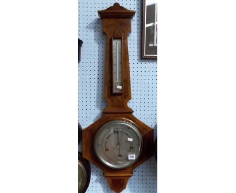 1940's walnut inlaid aneroid barometer/thermometer with silvered dial within a shaped case, height 35'.