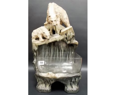 Good Goldscheider style painted pottery goldfish bowl, modelled as a polar bear mother & cub upon rocks, overlooking a glass 