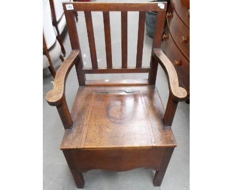 George III oak commode chair with square comb back.