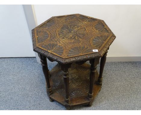 Octagonal carved top side table with base shelf