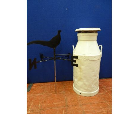 White painted metal milk churn and a black finished weather vane