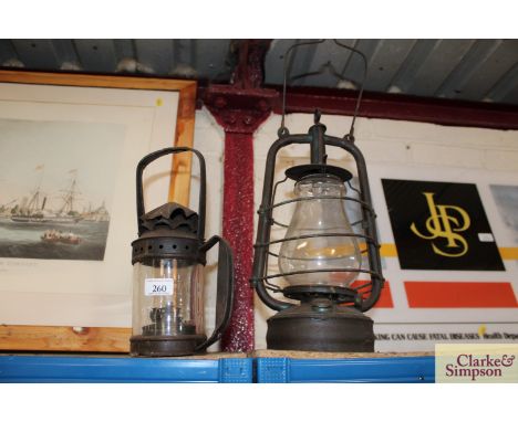 A vintage metal ware Hurricane lamp and a shepherds hand held lamp