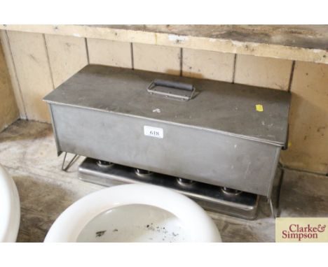 A vintage four burner mobile doctors sterilising pan