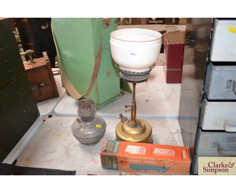 An Aladdin lamp with spare Loxon chimney in original cardboard box, and an oil lamp font 