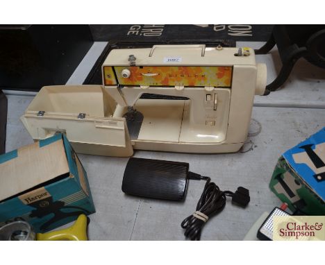 A Singer Starlet sewing machine - sold as a collector's item 