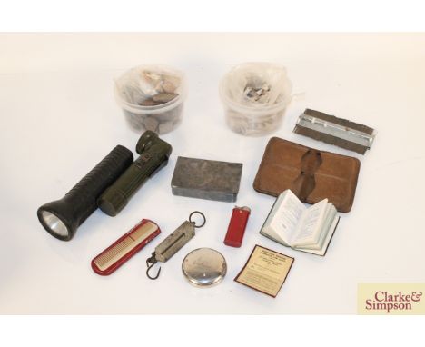 A box containing two vintage torches, a leather wallet, a small set of scales, heavy folding white metal box, two tubs of arc