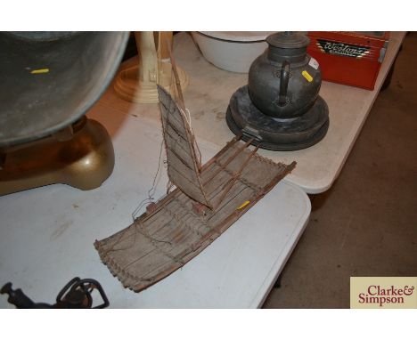 A vintage model of a Kon-tiki type raft