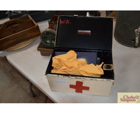 A vintage First Aid box and contents 