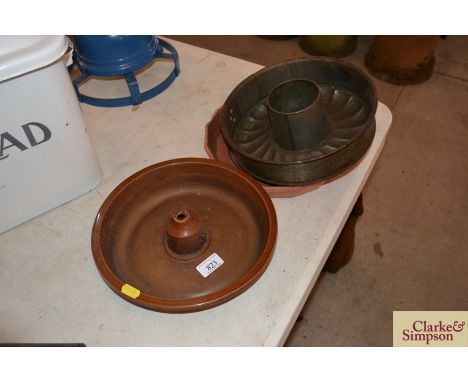 A vintage pie dish, a metalware blancmange mould and a flan dish