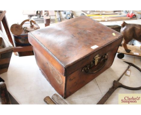 A vintage leather and brass mounted hat box, the lid initialled C.W.H.