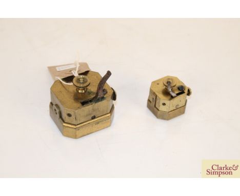 A Vintage brass blood letting instrument and a smaller example by Thompson of London