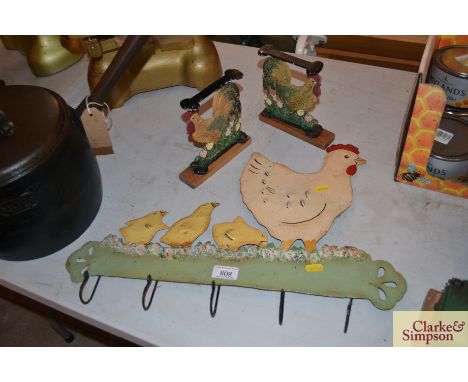 A metalware hen and chicks decorated coat hook and two metalware chicken decorated shelf supports