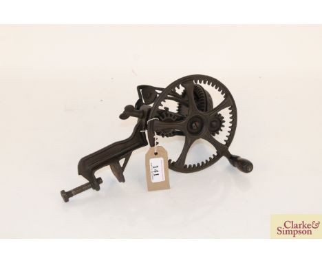 A cast iron apple peeler by The Reading Hardware Co. U.S.A.