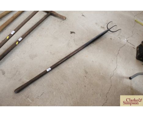 A three pronged pitch fork