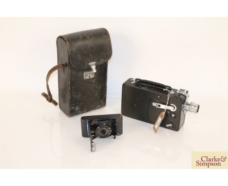 A vintage Kodak cine camera Model K with carrying case, and a vest pocket Kodak camera Model B