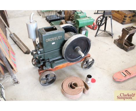 A Crossley Model 1040 3.5Hp stationary engine No.132099 on trolley with literature, complete with driving belt, fasteners and