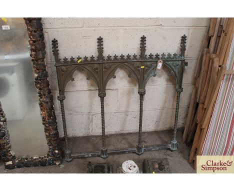 A Victorian Gothic brass gate