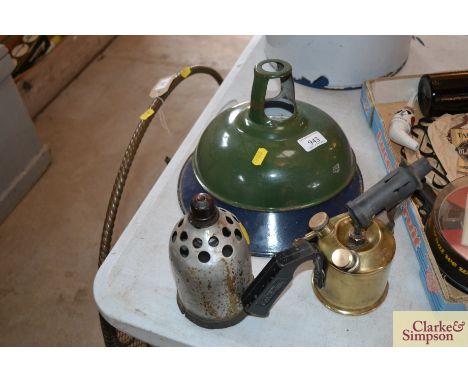 A vintage blow lamp, two enamel light shades and a vintage ceiling light
