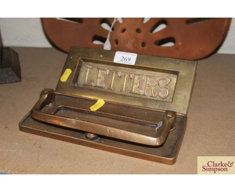 A vintage brass letter box inscribed "Letters" and a brass door knocker letter box 