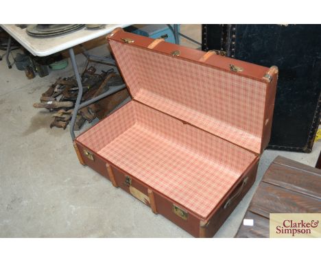 A wooden bound steamer trunk