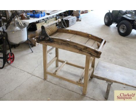 A vintage wooden and iron mounted butter roller 