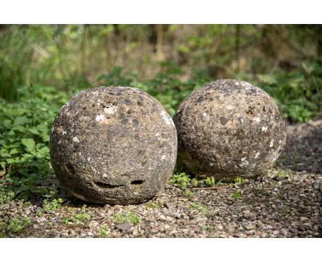 A PAIR OF HAMSTONE BALLS  18TH CENTURY  each approximately 44cm diameter  Condition Report:  With weathering - colour varianc