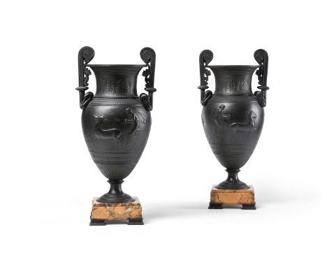 A PAIR OF BRONZED METAL TWIN HANDLED URNS OF KRATER FORM  LATE 19TH CENTURY  Each with Apulian style scrolling handles above 