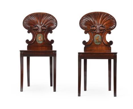 A PAIR OF GEORGE IV MAHOGANY HALL CHAIRS ATTRIBUTED TO GILLOWS, CIRCA 1825 Each central medallion with a painted crest each 8